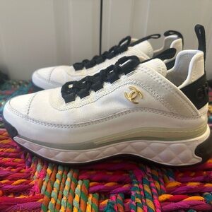 CHANEL White and Black Athletic Shoes with Gold Logo